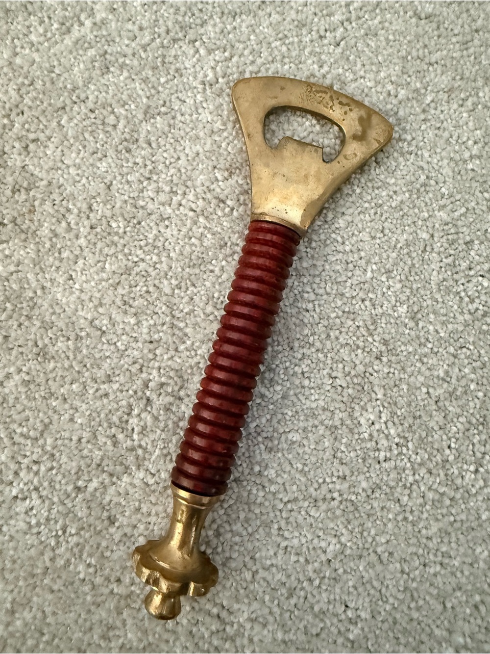 Bottle Opener with Ribbed Red Handle brass